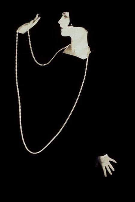 Louise Brooks in black with pearls